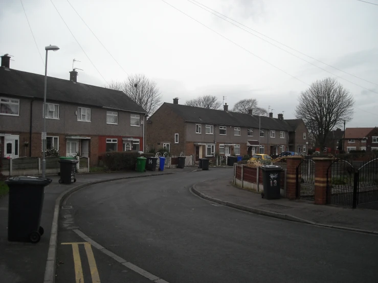 a small round road runs between two row houses