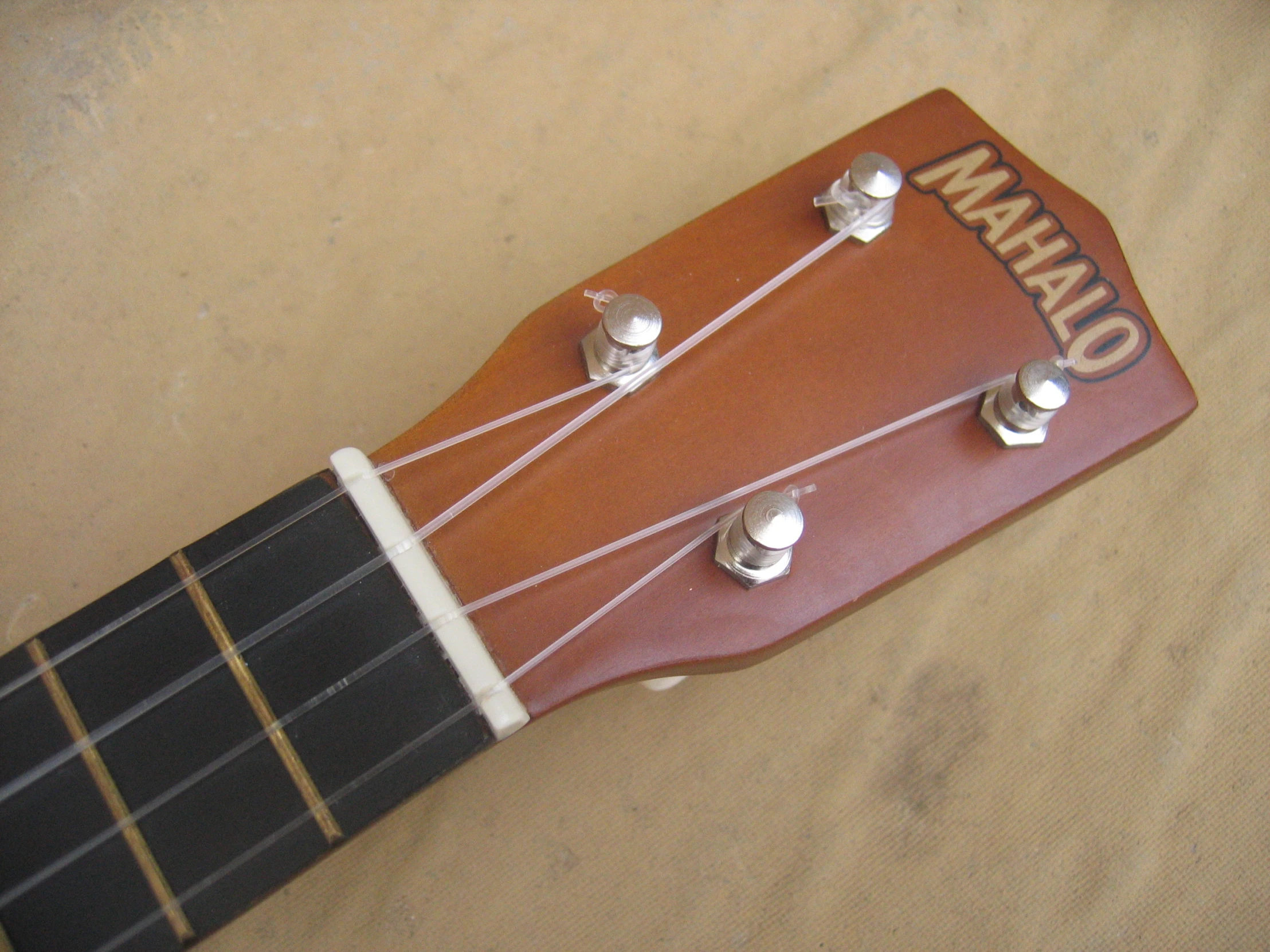 a guitar string attached to an overhang with the logo of idaho on it