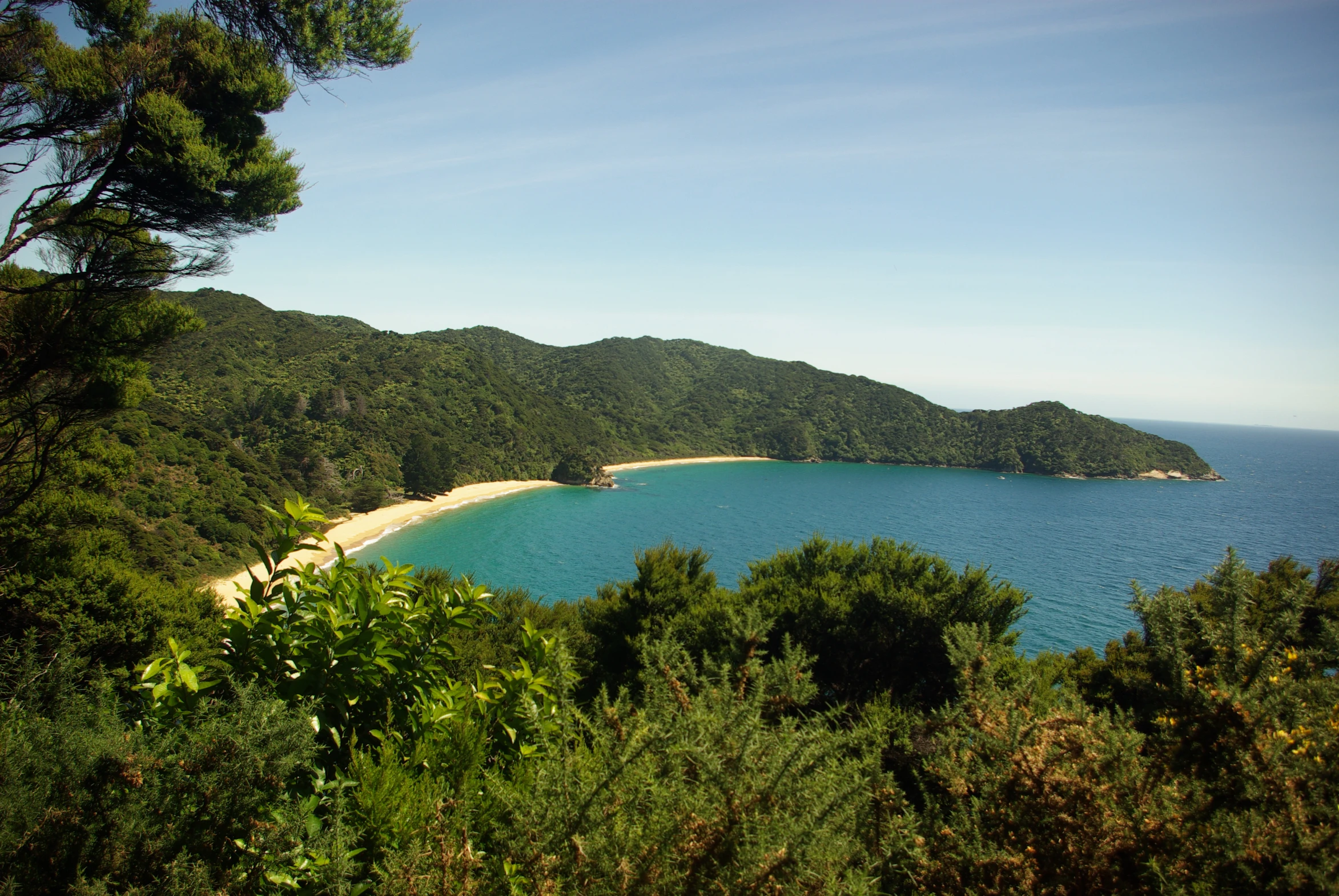 the blue ocean is next to a large island