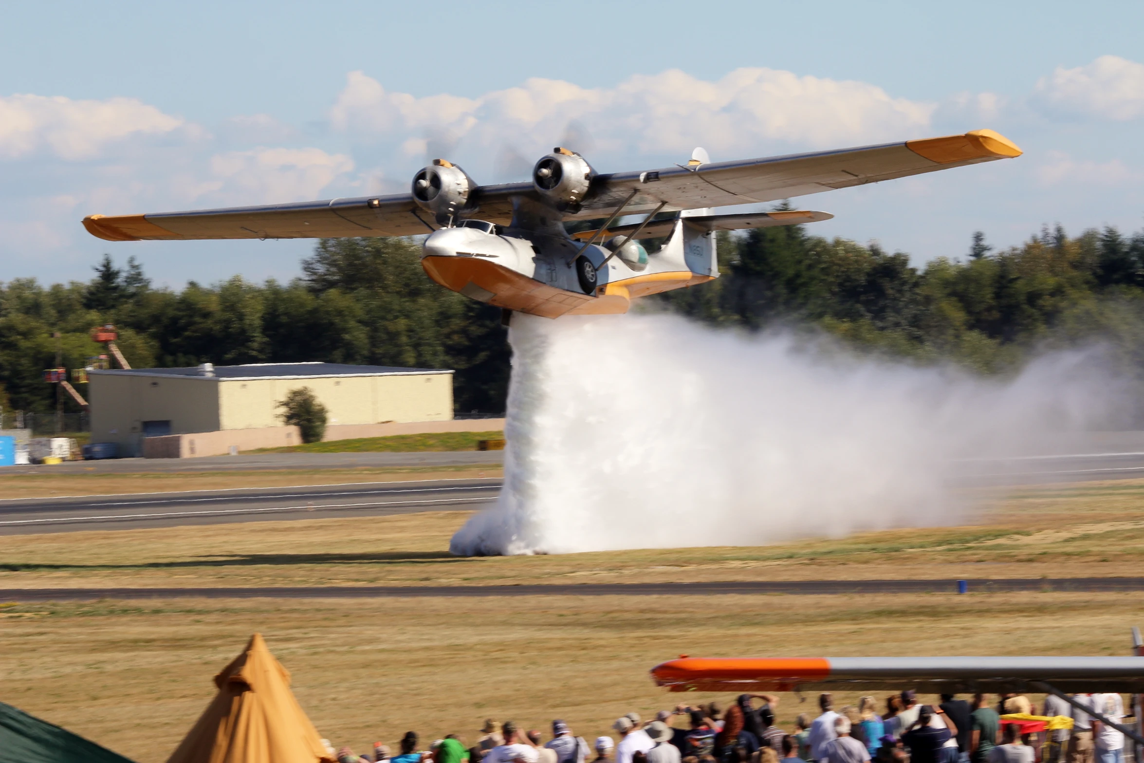 an air plane with some smoke flying