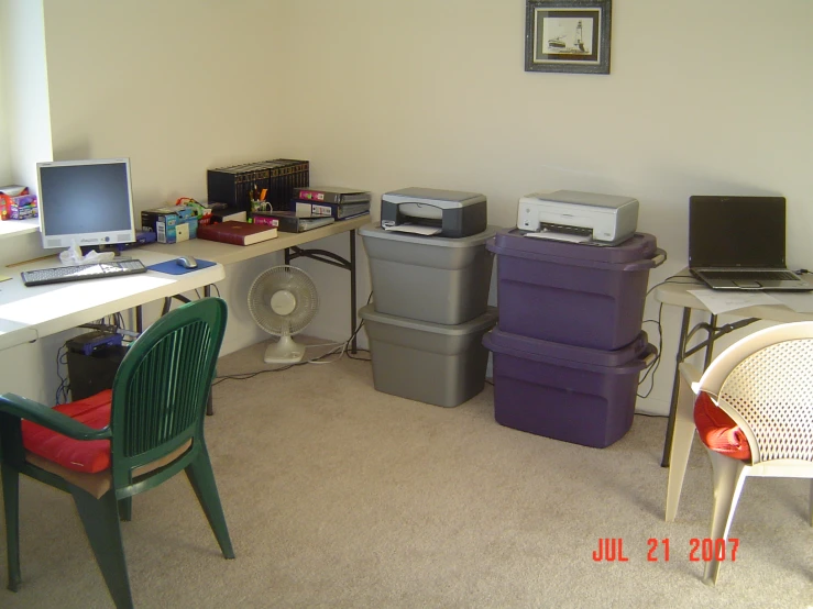 a work desk in the middle of several boxes