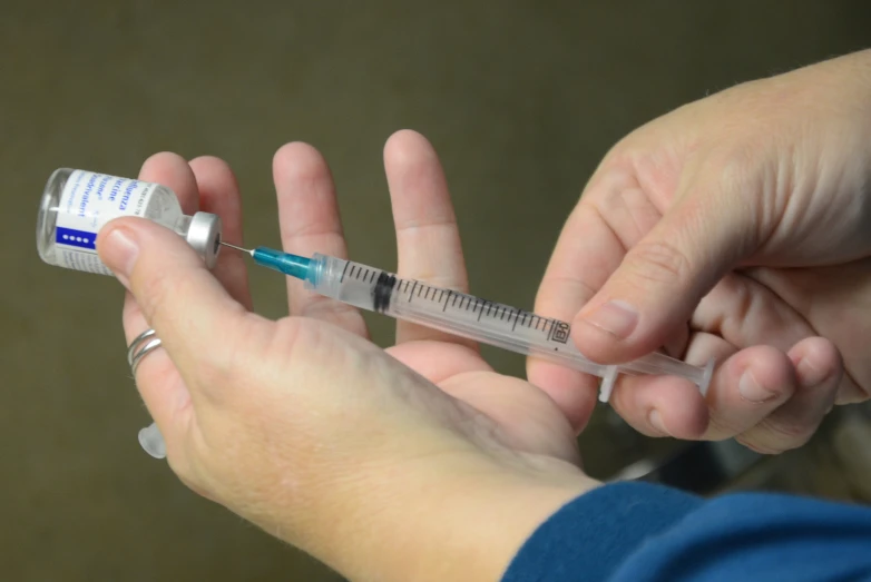 a person holds a medical instrument in their hands