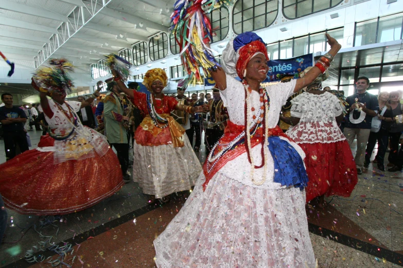 people in traditional mexican attire playing a game of tug of war