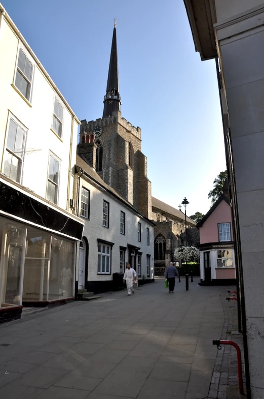 people walk on the street in a town