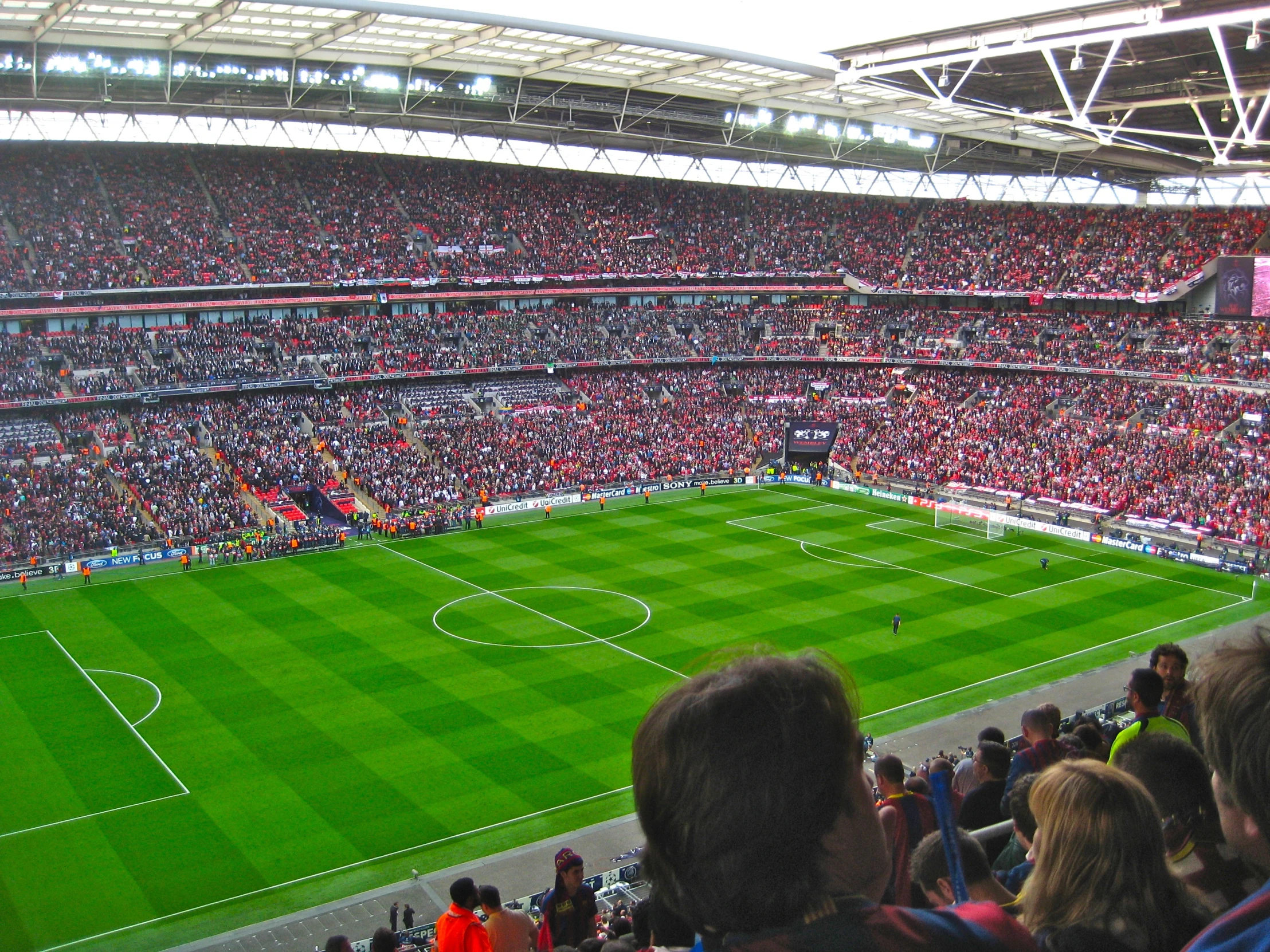 an overhead view of a soccer field with many people watching