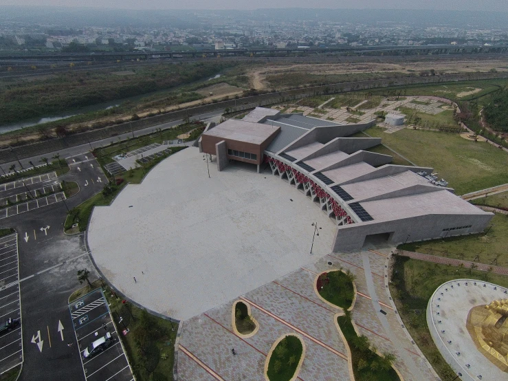 the aerial view of a large building in the middle of a city