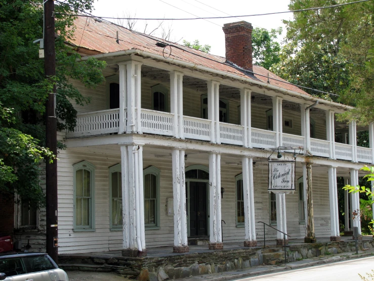 an old victorian house is in a town