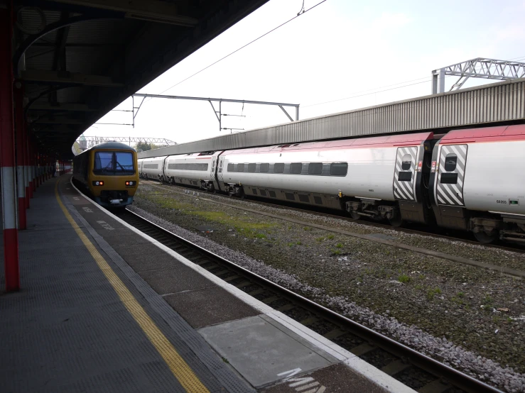 a passenger train pulling into a train station