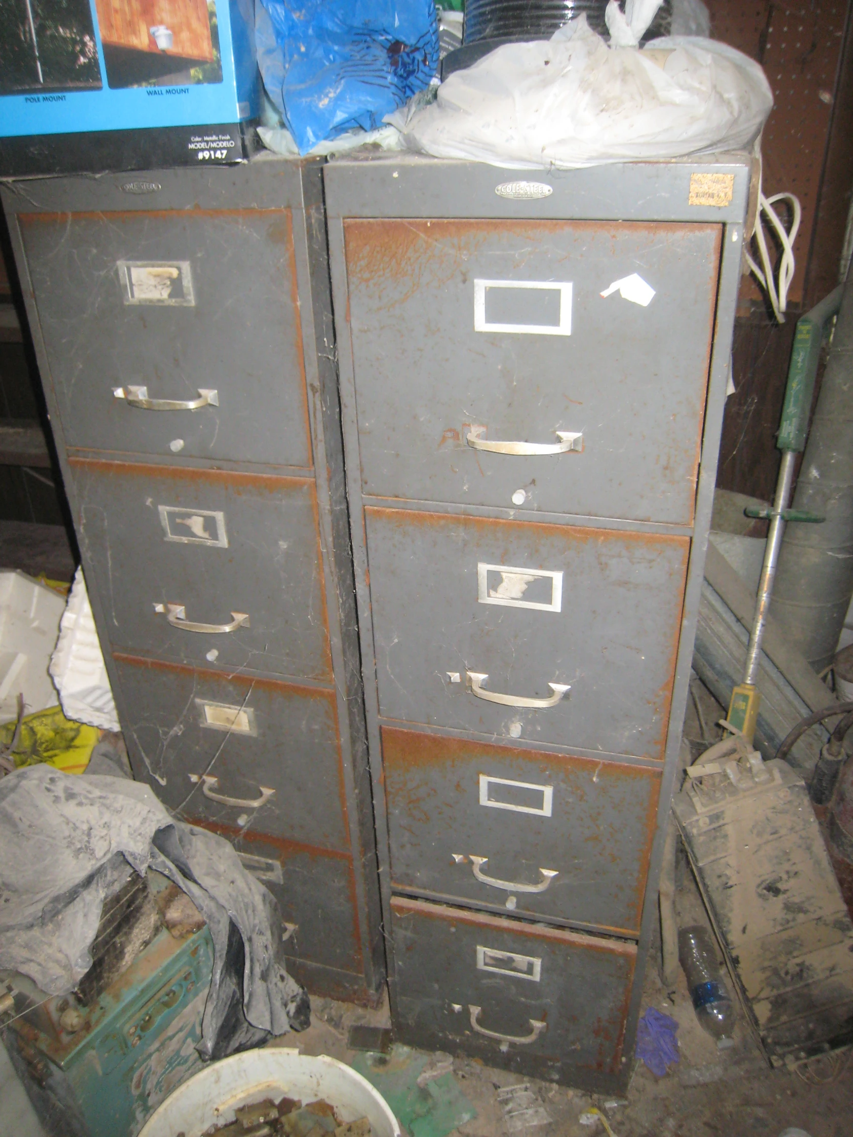 two industrial drawers with two cats on top of them