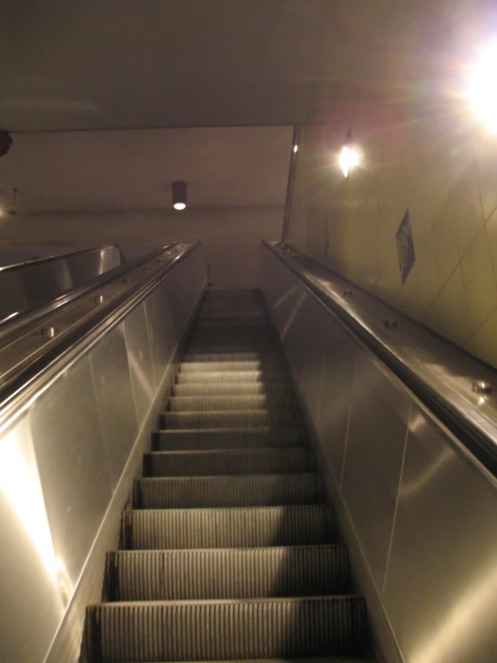 the escalator of an empty subway station