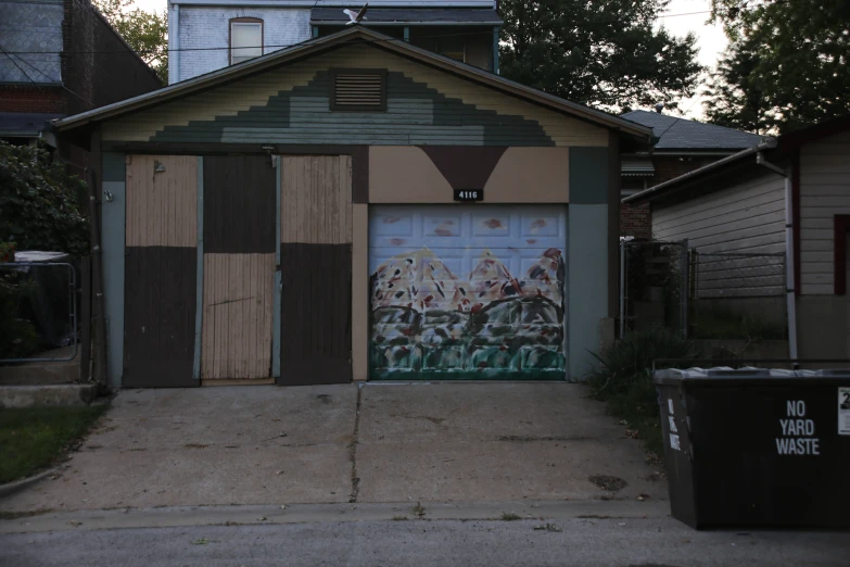 a garage with a mural of a baseball game painted on it