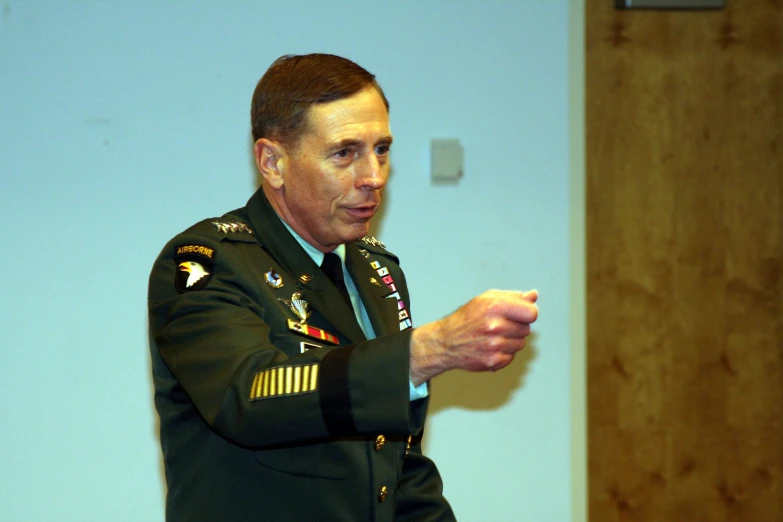 a man in military uniform giving a presentation