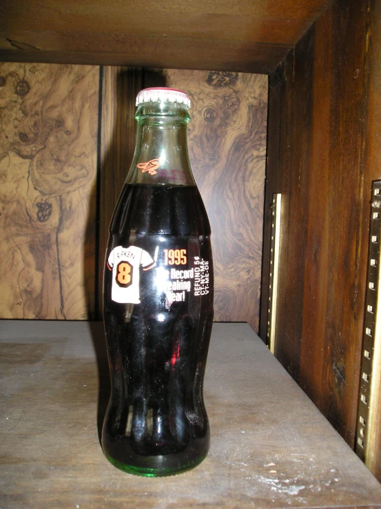 an open glass bottle sitting on a counter