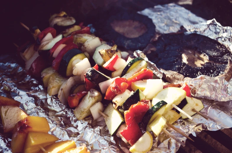 a group of sticks of vegetables on top of foil