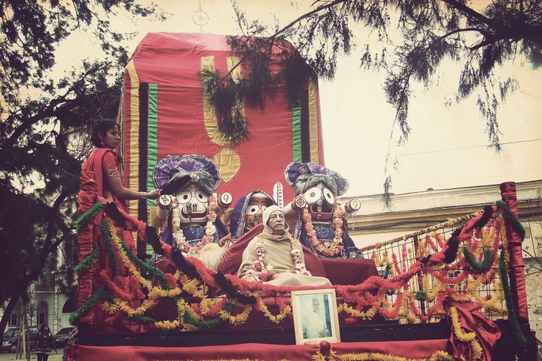 a float with an ornately decorated horse and woman on it