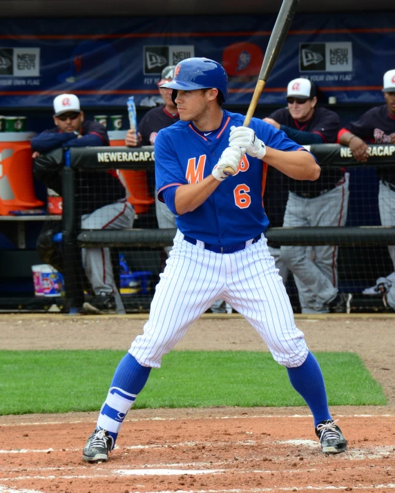 a man at bat standing near home plate at a baseball game