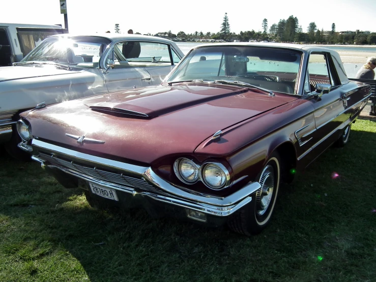 a red and white car on display at an event