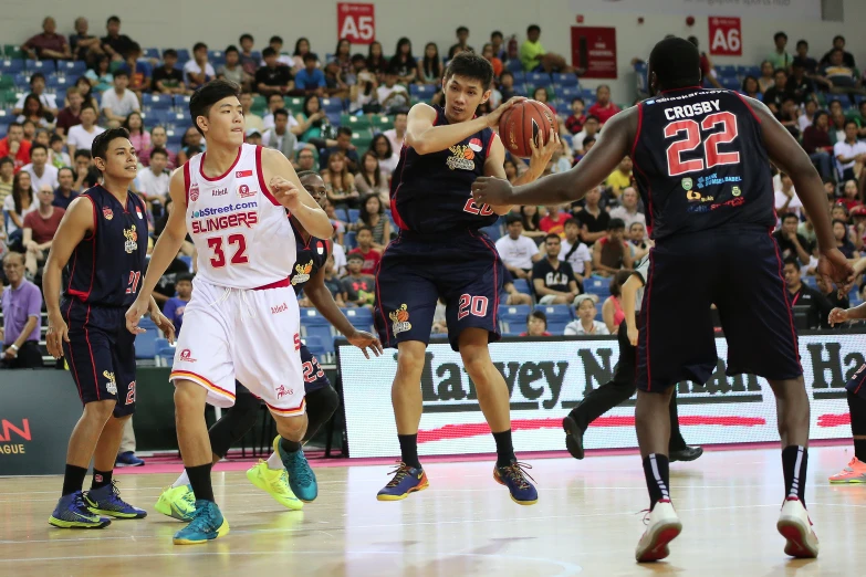 a group of basketball players playing a game