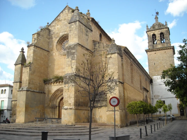 an old building with a tree in front