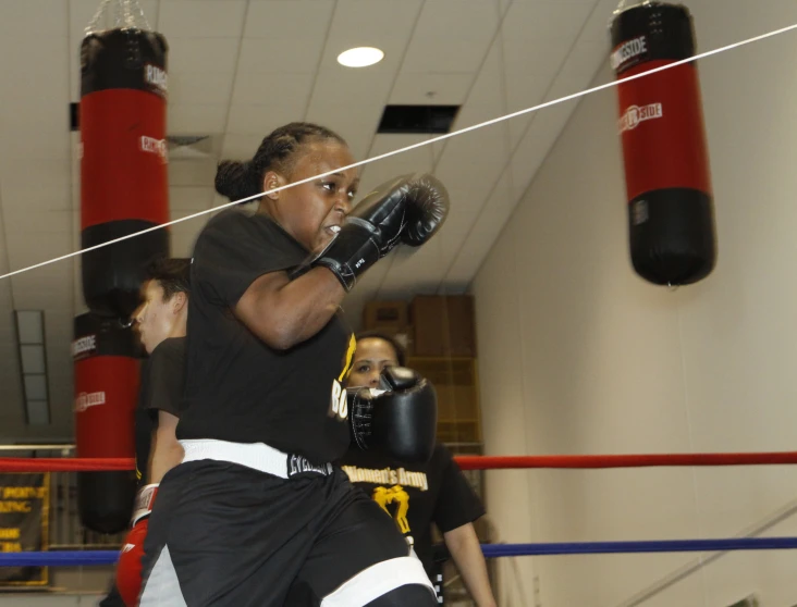 two women in boxing stances before a game