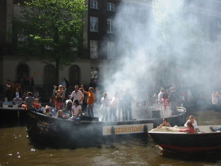 smoke is emitting from a boat with people on it