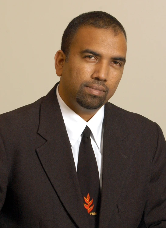 a man in a suit is staring into the camera