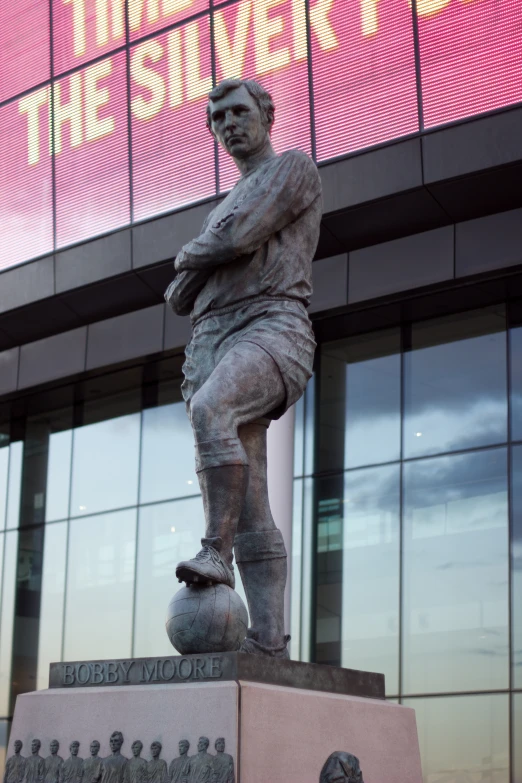 a soccer statue in front of the denver denver field