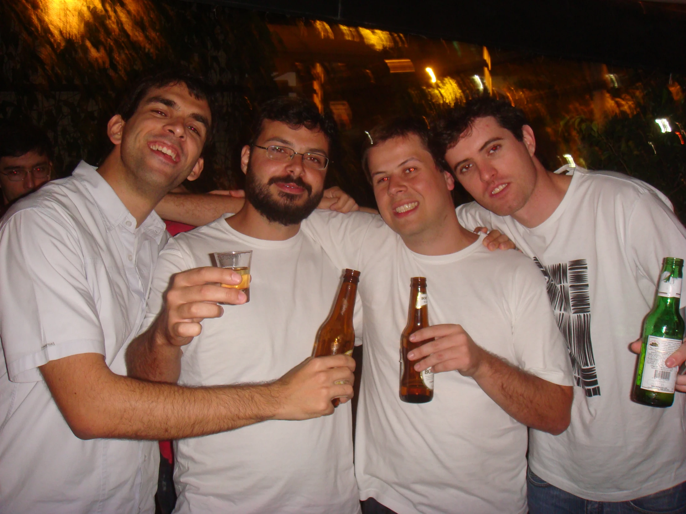 the young men are drinking beer together