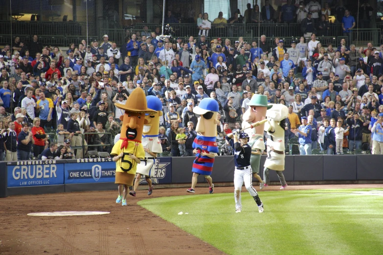 the mascot of baseball team is running for the first base line