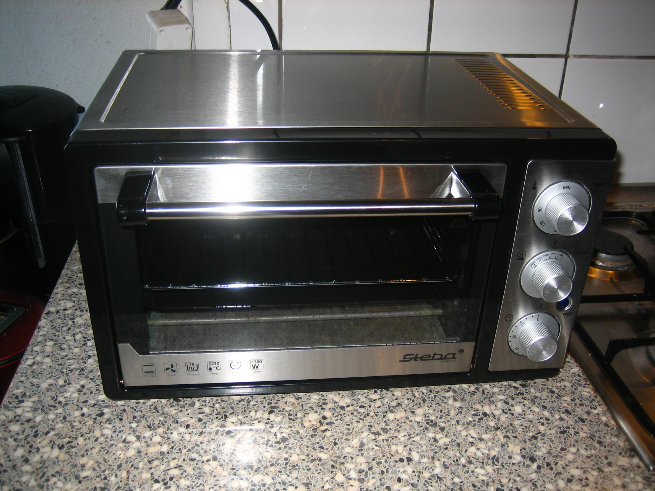 a toaster oven on the counter in the kitchen