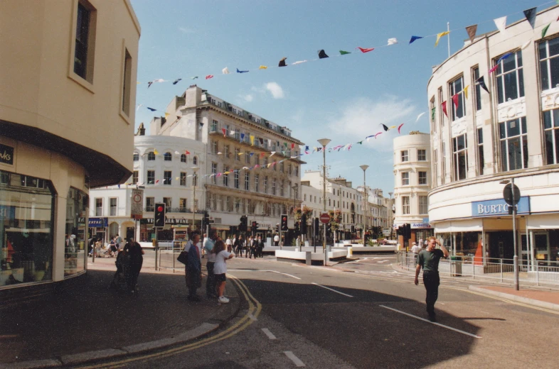 a wide, empty city street in the middle of a town