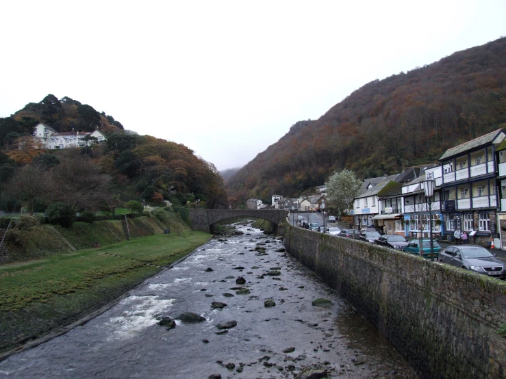 several long buildings stand next to the river