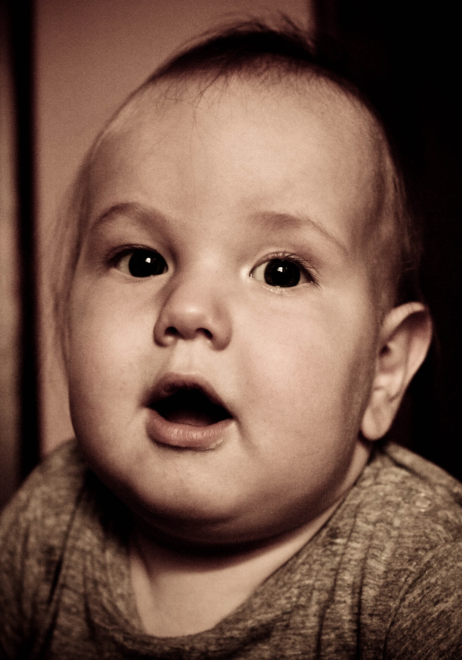 a close up of a child with an open mouth