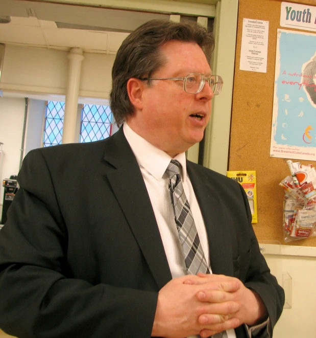 a person in a suit and tie talking