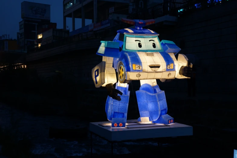 a statue made out of an old toy car