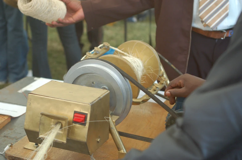 two people  and making a piece of wooden