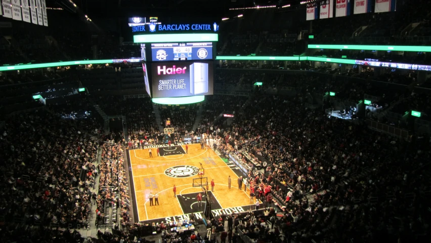 an overhead view of an arena, where basketball is being played