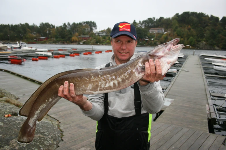 the fisherman shows off the big catch he caught