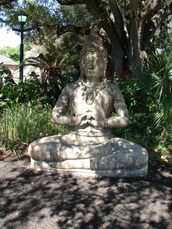 a stone buddha statue is shown on the ground