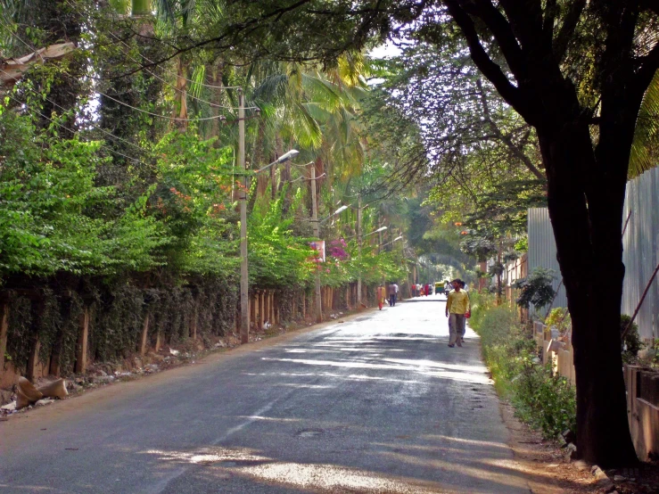 a large street with several cars and people riding motorcycles