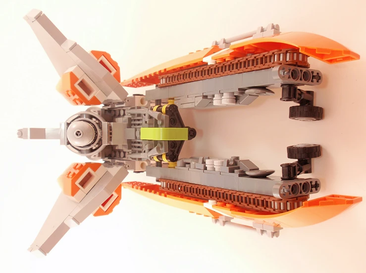 the model is made with legos, and sits on a white surface