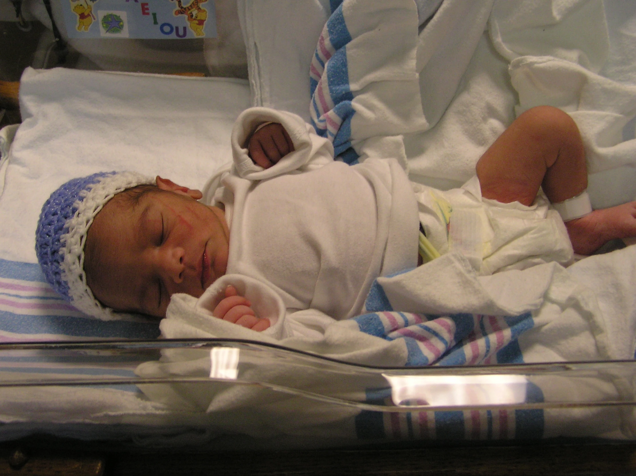 a baby in the hospital is wearing a gown