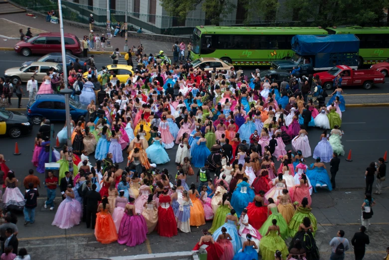 large group of people on street in costumes