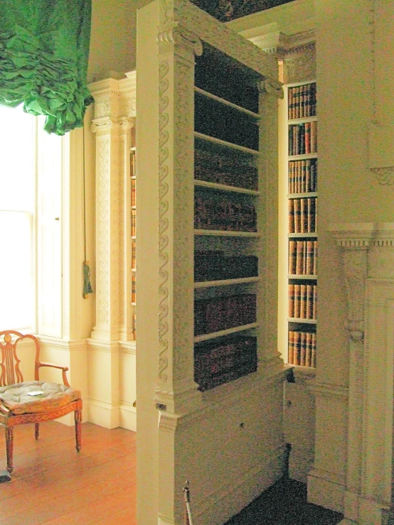 a room with some old books and chairs