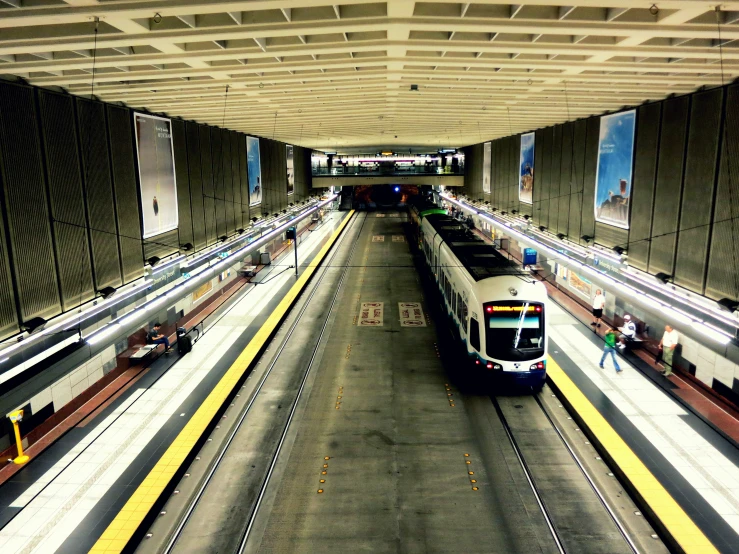 a passenger train that is pulling up to a station