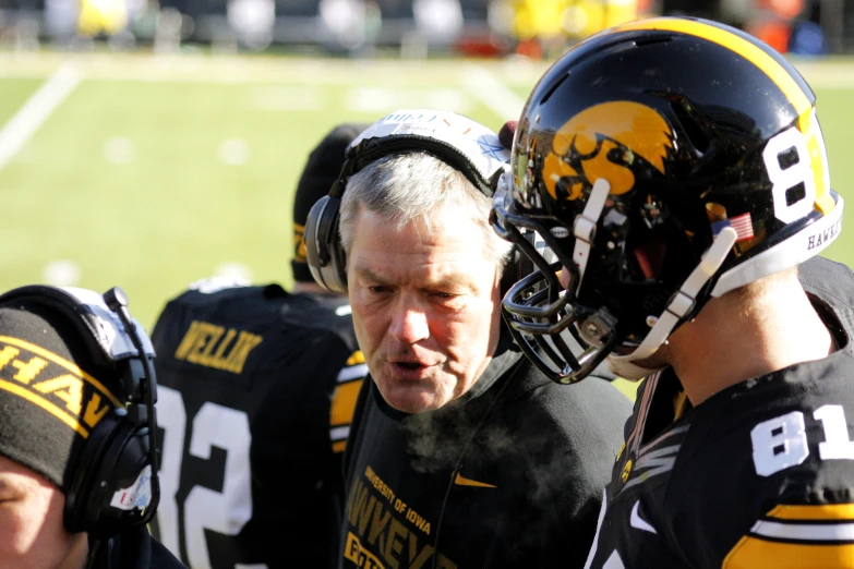 a coach with his team on the sidelines