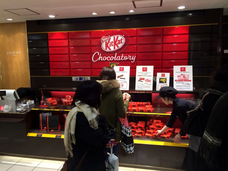 the display case of a restaurant has red decorations on it