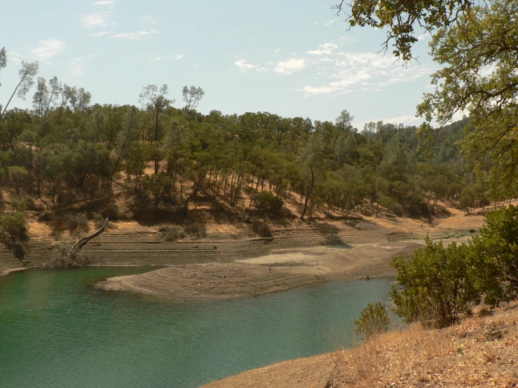 a large body of water surrounded by some hills