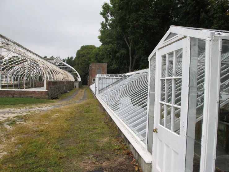 a white fence that has a lot of windows