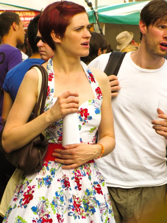 a man and woman walking in the street